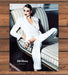 Bill Blass Neiman Marcus Model in White Pantsuit on Settee Print Ad 1998 1990s