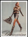 Blumarine 2010s Print Advertisement 2010 Legs Snakeskin Skirt Walking Fast Fetch-the-Paper