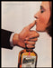 Cointreau 1980s Print Advertisement Ad 1984 Woman Kissing Thumb Fetch-the-Paper