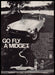 MG Midget 1970s Print Advertisement 1977 "Go fly a Midget" Car Park Couple MG Midget