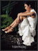 Vera Wang 2010s Print Advertisement 2013 Legs Folded Sitting on Log Fetch-the-Paper