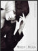 White House Black Market 2000s Print Advertisement 2009 Blonde Hat Sexy Fetch-the-Paper